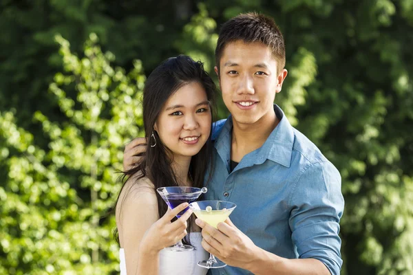 Young Adult Couple enjoying the warm day outdoors with a few dri — Stock Photo, Image