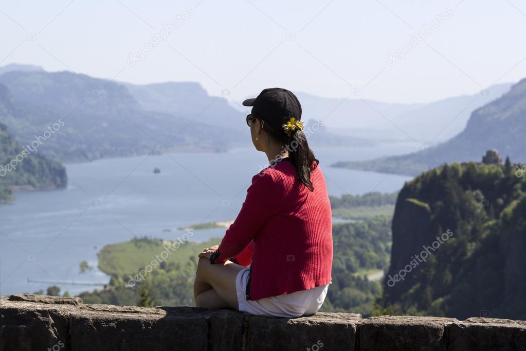 Mature woman viewing the Columbia River Gorge from high above