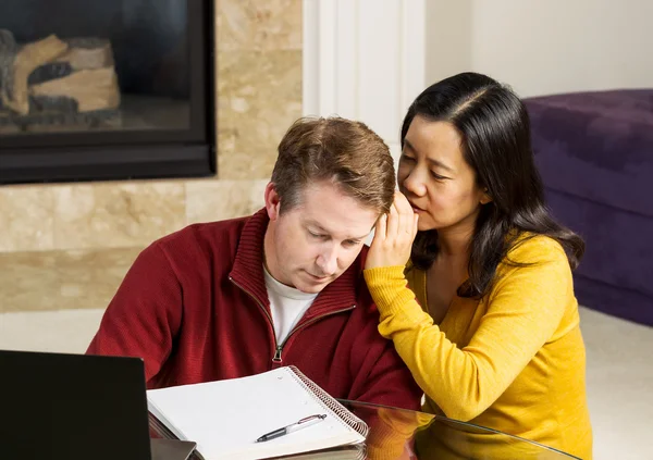 Mature woman whispering into Coworker ear — Stock Photo, Image