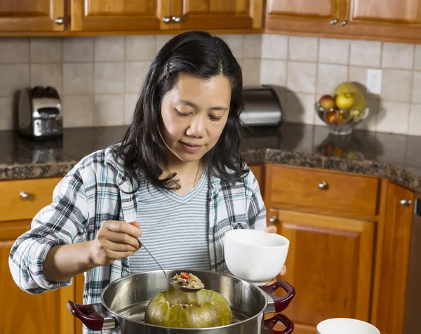 Mature Woman Cooking Winter Melon at home — Stock Photo, Image