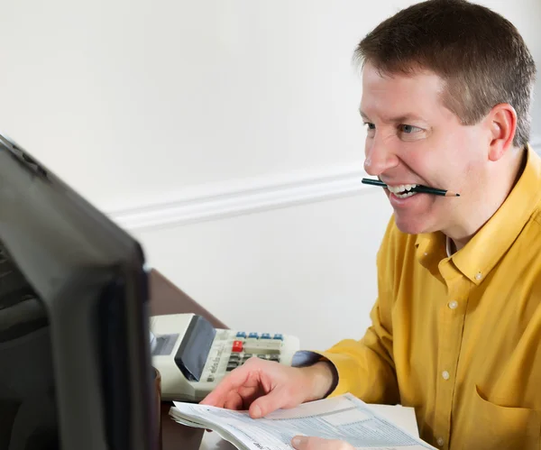 Mature man showing stress while doing Taxes — Stock Photo, Image
