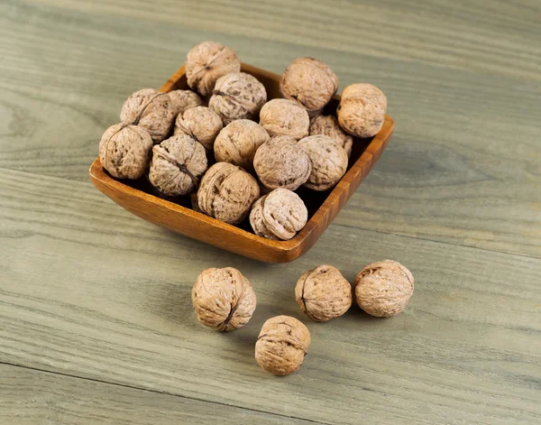 Unshelled Walnuts in Bowl — Stock Photo, Image