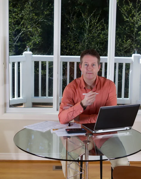 Mature man preparing to work on forms — Stock Photo, Image