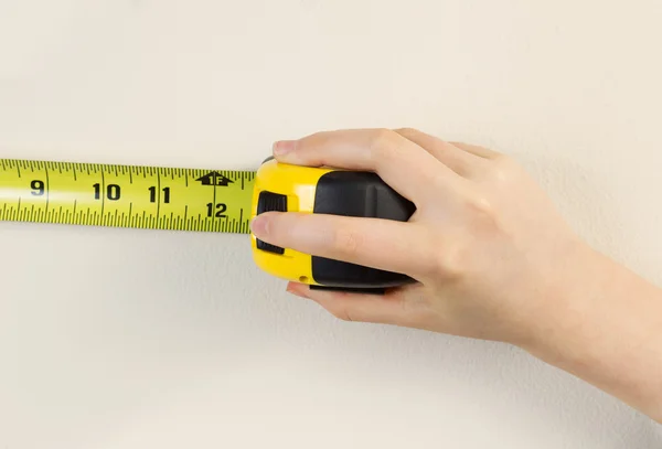 Tape Measure against white wall — Stock Photo, Image