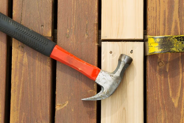 Aligning New Wood into Cedar Deck — Stock Photo, Image