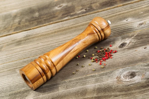 Wooden Pepper Mill on Rustic Wood — Stock Photo, Image
