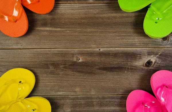 Sandal tops forming circle on wooden boards — Stock Photo, Image