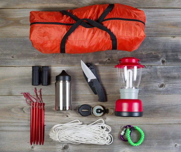 Camping Gear on Rustic Wooden Boards — Stock Photo, Image