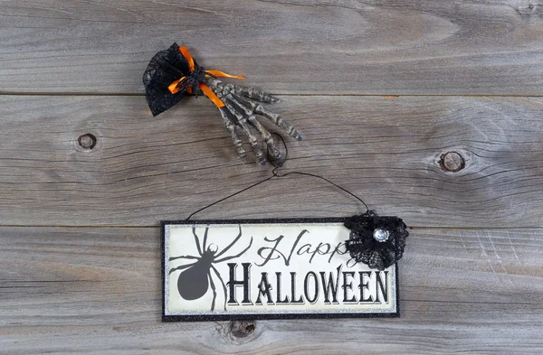 Halloween hand and sign on wood — Stock Photo, Image