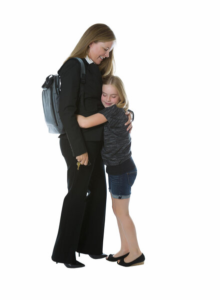 Mother getting hug from younger daughter when coming home from w