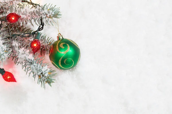 Christmas Ornament with Lights hanging from Tree Branch — Stock Photo, Image