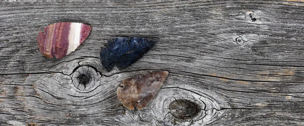 Three North America Native American Flint Arrowheads Rustic Wood Surface — Photo