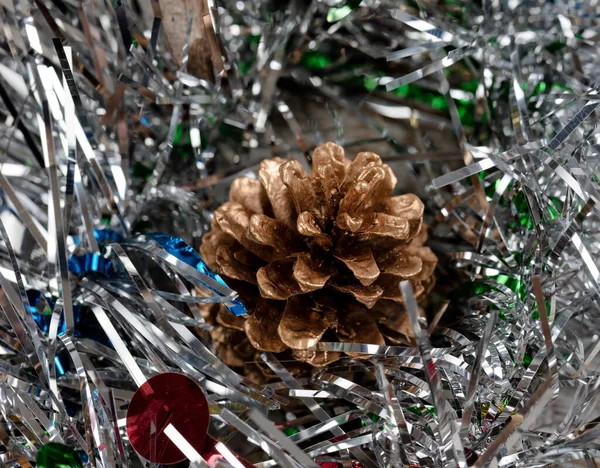 Close Single Gold Pine Cone Silver Tinsel Holiday Season Christmas — Stock Photo, Image