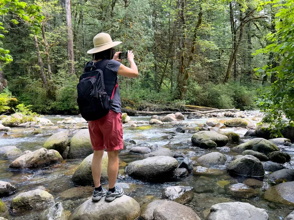 Woman Taking Photos Her Smartphone Small River Washington State Summer — Fotografia de Stock