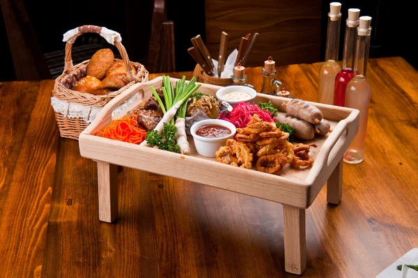 Tasty food on a wooden table — Stock Photo, Image