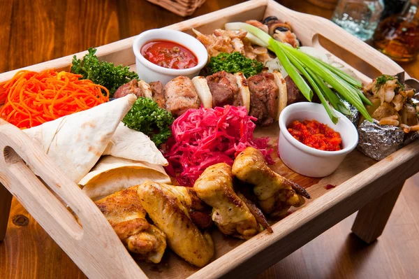 Tasty food on a wooden table — Stock Photo, Image