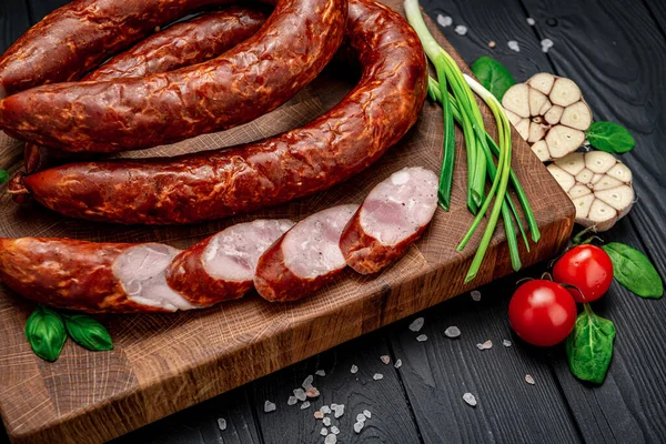 Dry Appetizing Smoked Pork Sausage Dark Background Different Spices Vegetables — Stock Photo, Image