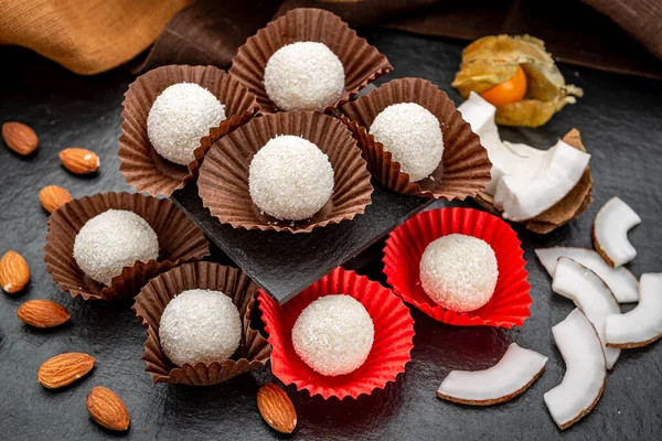 Coconut candies covered with coconut crumbs. Coconut candies covered with coconut crumbs