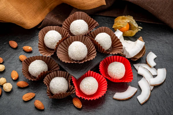 Coconut candies covered with coconut crumbs. Coconut candies covered with coconut crumbs