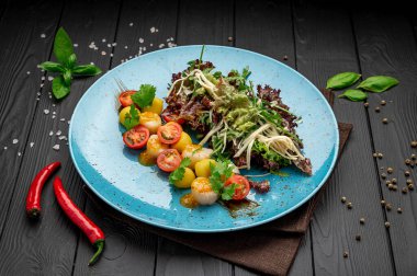 Grilled sea scallops with lettuce and tomatoes. Photo for the restaurant menu