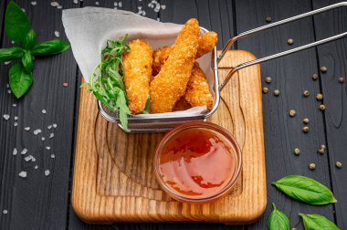 Crispy fried shrimp with spicy sauce. Photo for the restaurant menu