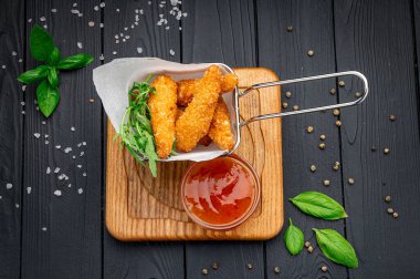 Crispy fried shrimp with spicy sauce. Photo for the restaurant menu