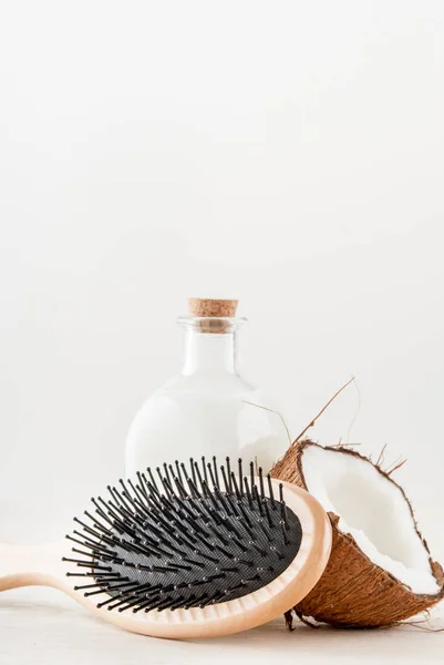 hair care concept with coconut oil on white background. High quality photo