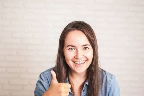 positive woman smiling on a light background. High quality photo