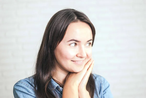 positive woman smiling on a light background. High quality photo