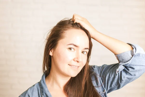 positive woman smiling on a light background. High quality photo