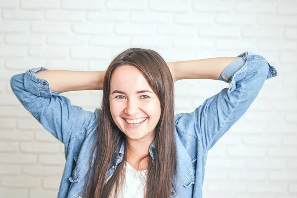 positive woman smiling on a light background. High quality photo