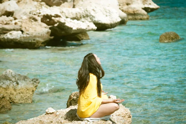 Young Woman Yellow Bright Scarf Meditating Rocks Sea — Stock Photo, Image