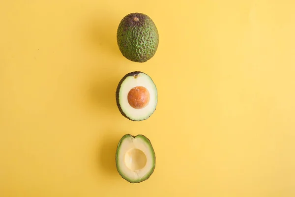 Top View Studio Photo Avocadoes Isolated Yellow Background — Stock Photo, Image