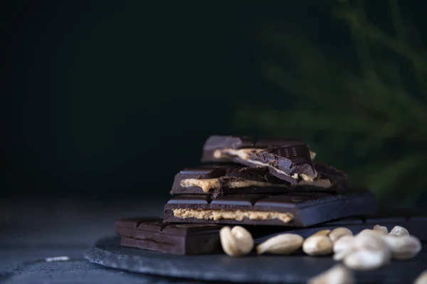 homemade chocolate with cashew cream fillings. dark food photo
