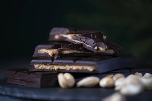 homemade chocolate with cashew cream fillings. dark food photo
