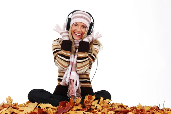 Autumn woman listening music Stock Picture