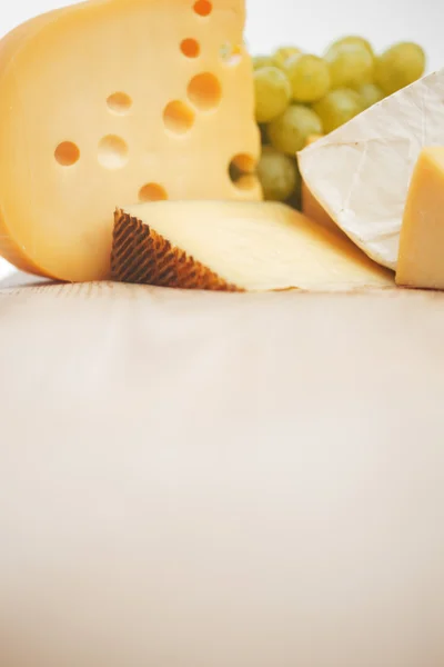 Cheese on a wooden table — Stock Photo, Image