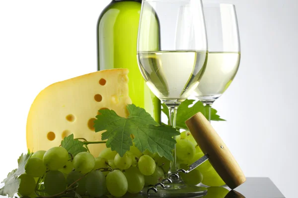 Bottle with white wine and glass and grapes — Stock Photo, Image