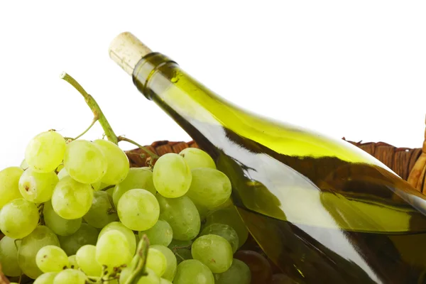 Bottle with white wine and grapes — Stock Photo, Image