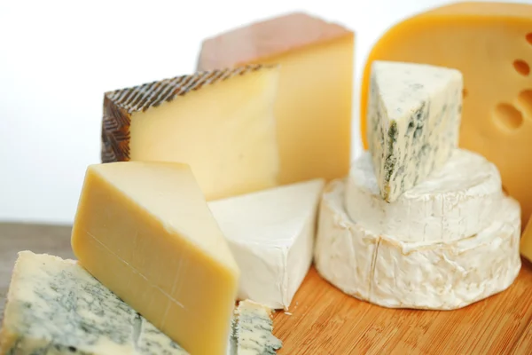 Cheese on a wooden table — Stock Photo, Image