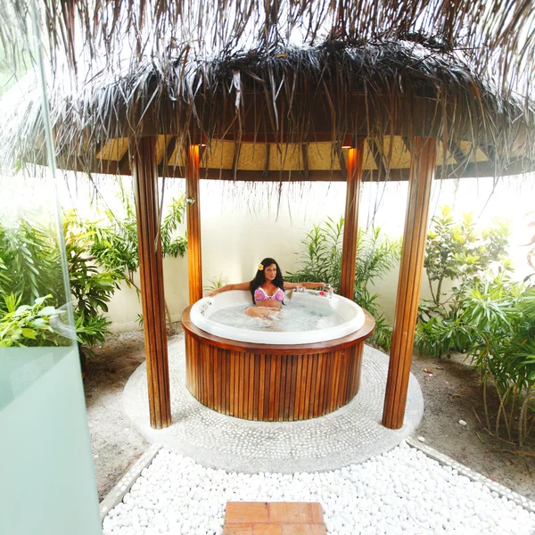 Pretty woman relaxing in jacuzzi — Stock Photo, Image