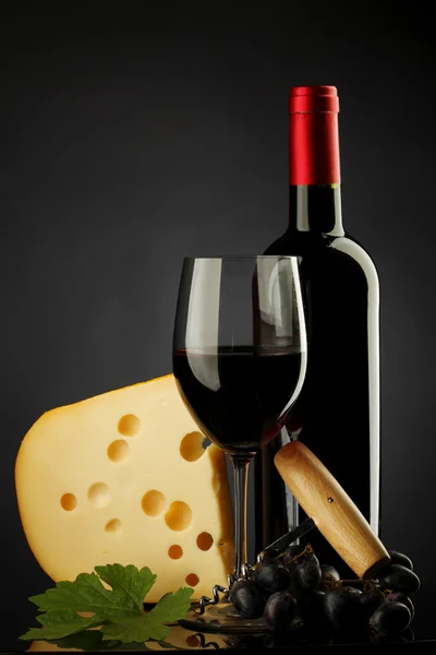 Red wine and cheese on black Stock Image