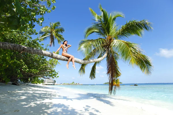 Woman on palm on sea backgroud — Stock Photo, Image