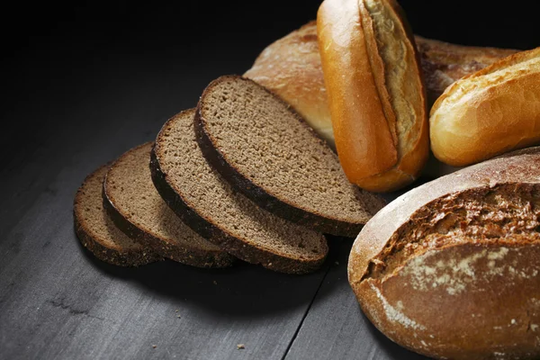 Various sliced bread on table — Stock Photo, Image