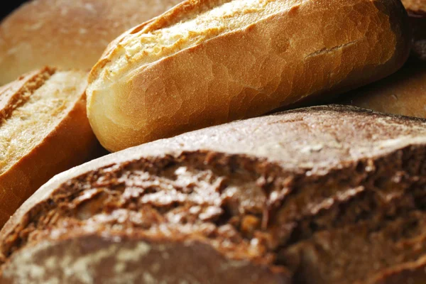 Olika bröd bakgrund — Stockfoto