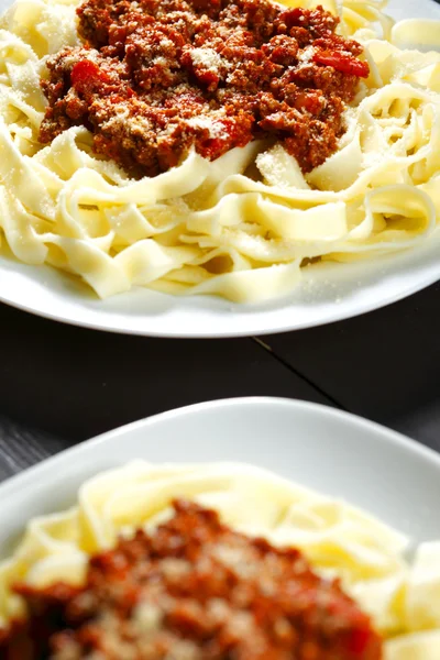 Spaghetti bolognese with parmesan cheese — Stock Photo, Image