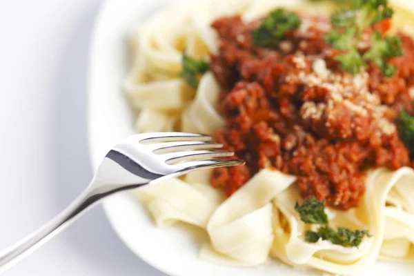 Spaghetti bolognese and fork — Stock Photo, Image