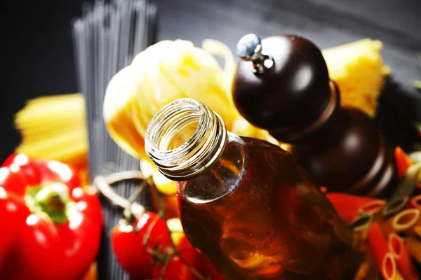 Pasta ingredients on black table — Stock Photo, Image