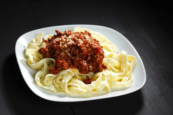 Spaghetti bolognese with parmesan cheese — Stock Photo, Image