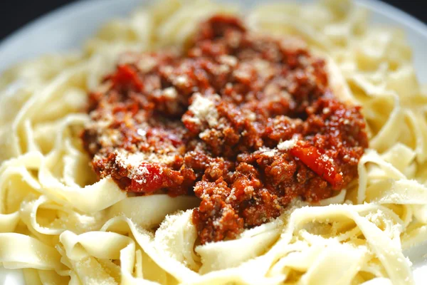 Spaghetti bolognese with parmesan cheese — Stock Photo, Image